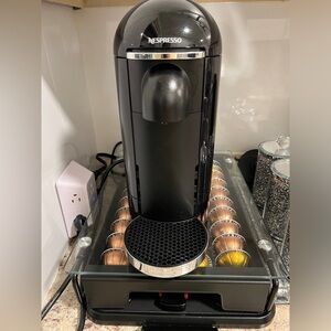 Nespresso machine with pods and storage tray